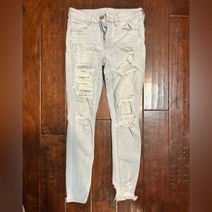 Light wash American eagle distressed skinny jeans